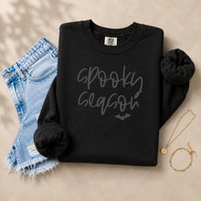 Load image into Gallery viewer, Cozy black fall crewneck sweatshirt featuring a textured 3D puff "Spooky Season" design and bat graphic, perfect for Halloween outfits and autumn fashion.