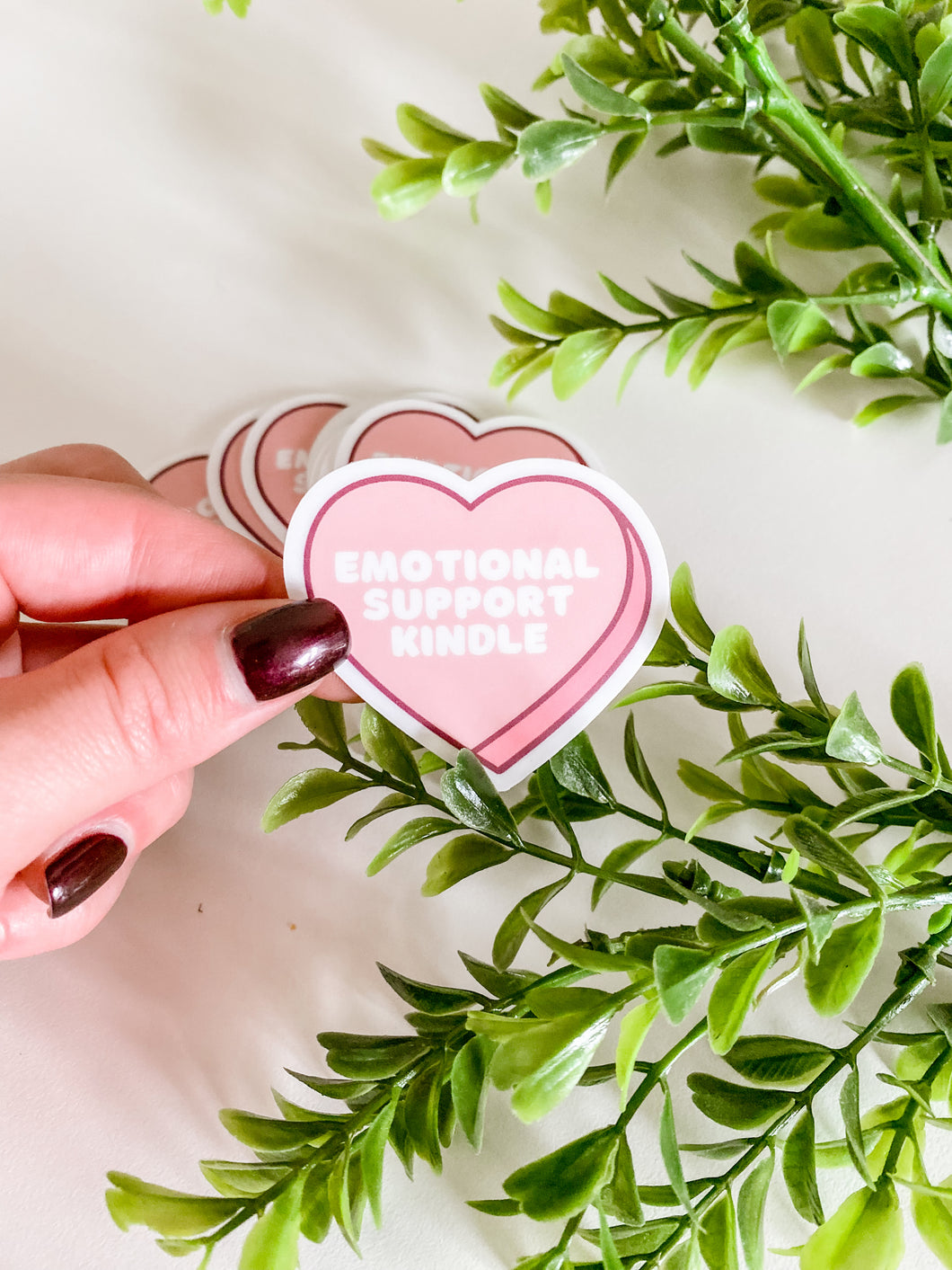 pink heart shaped sticker with saying 